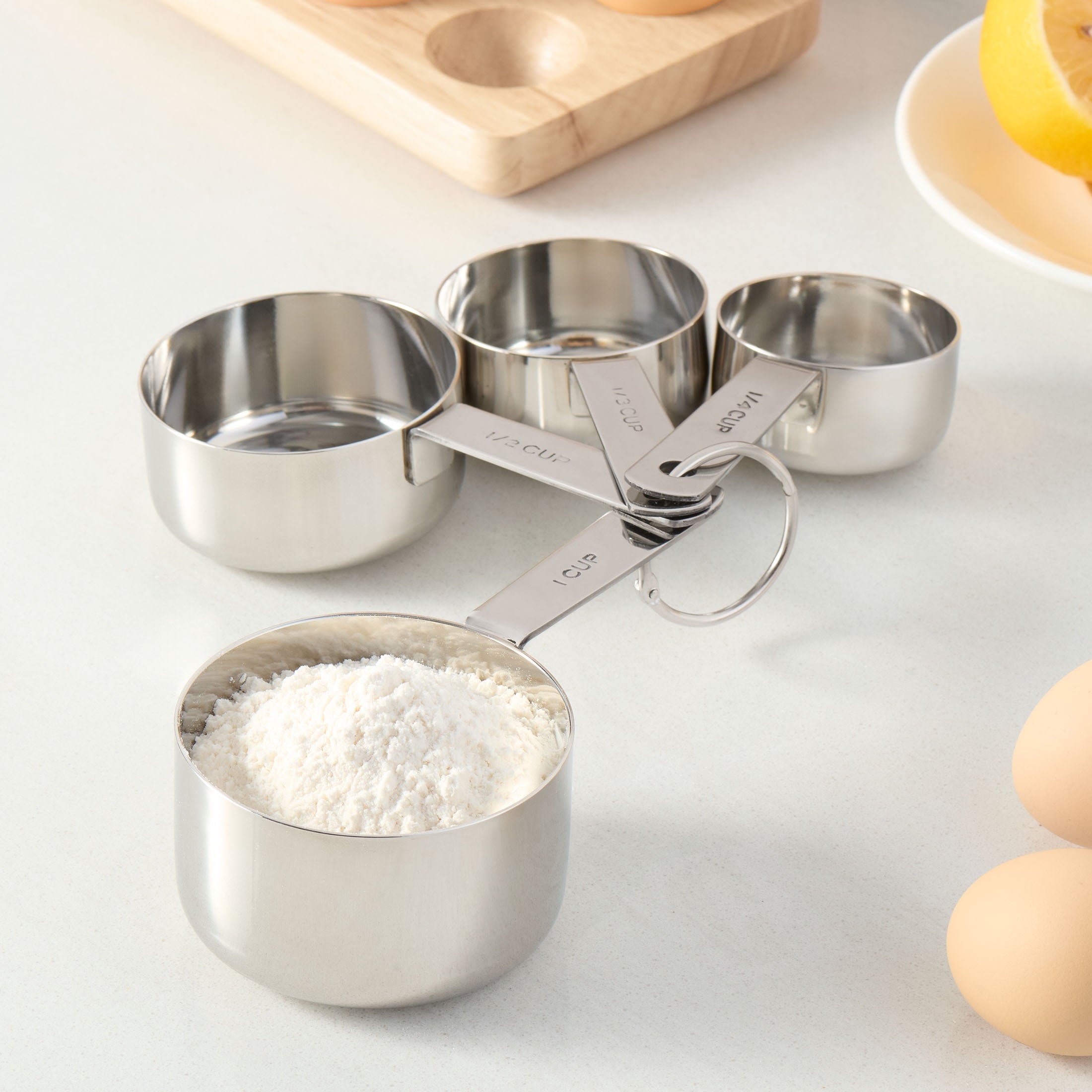 Innovative Kitchen Stainless Steel 4-Piece Nesting Measuring Cups - Premium Stainless Steel Garlic Presser & Peeler Detail